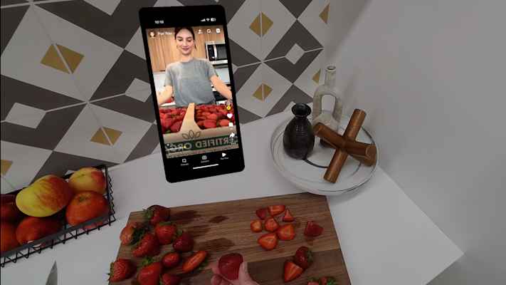 POV image from Spectacles of person using phone mirroring